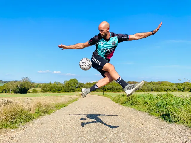Daniel leaping over a ball on a country path
