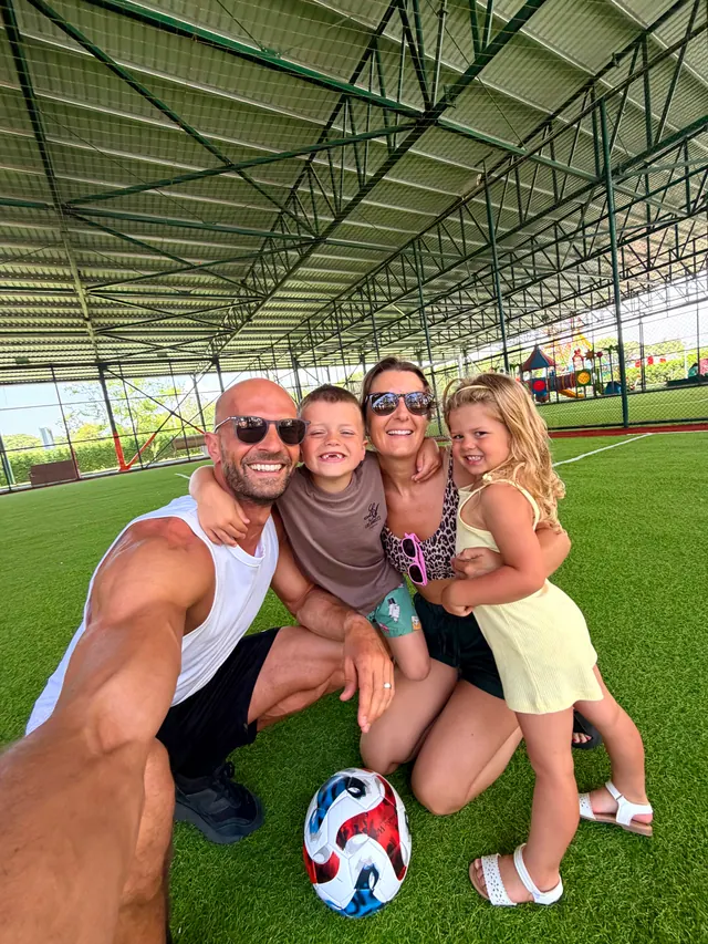 Daniel, Kelly and the children on an indoor pitch