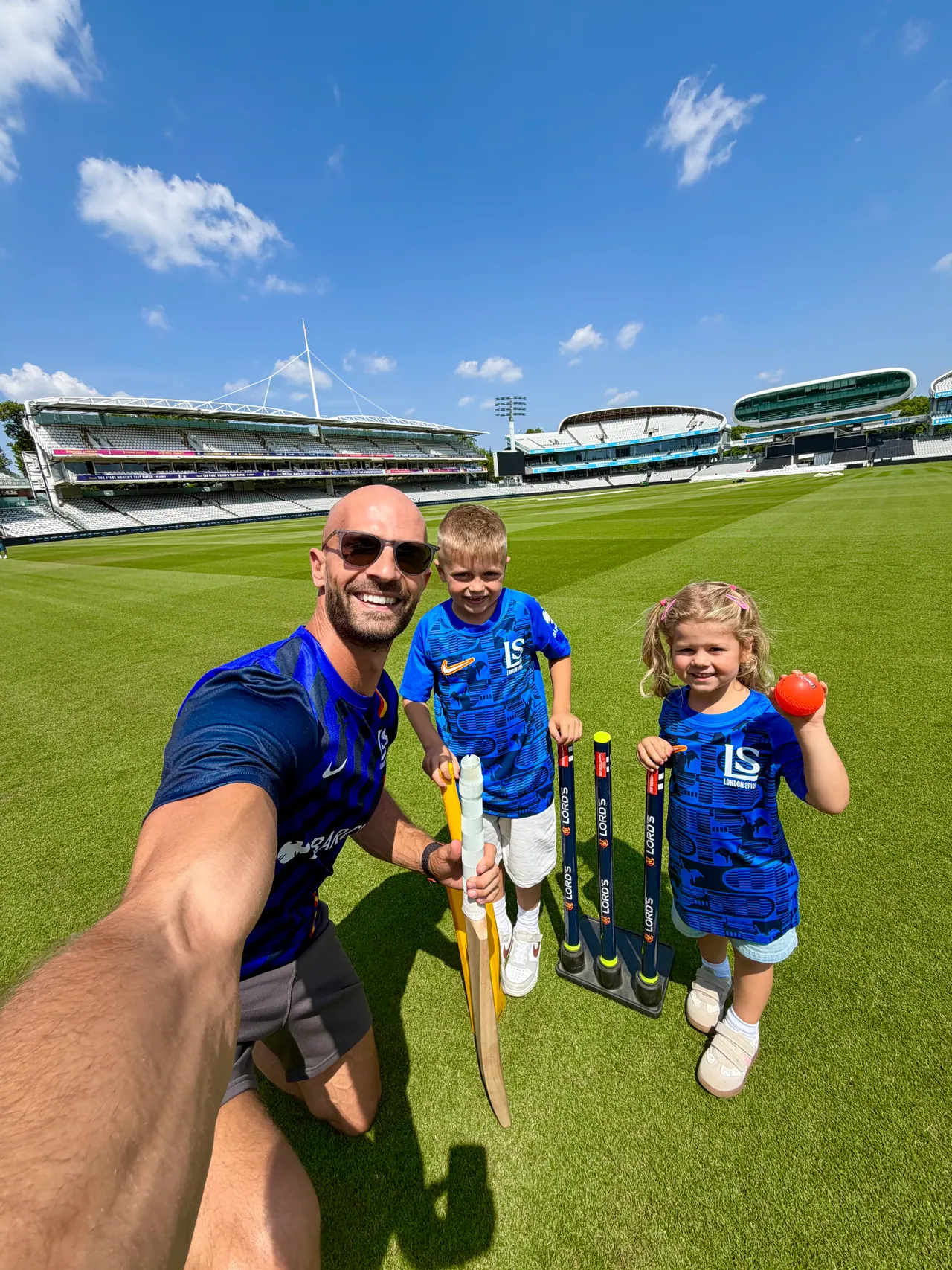 Daniel, Joshua and family at a corporate event at a cricket ground