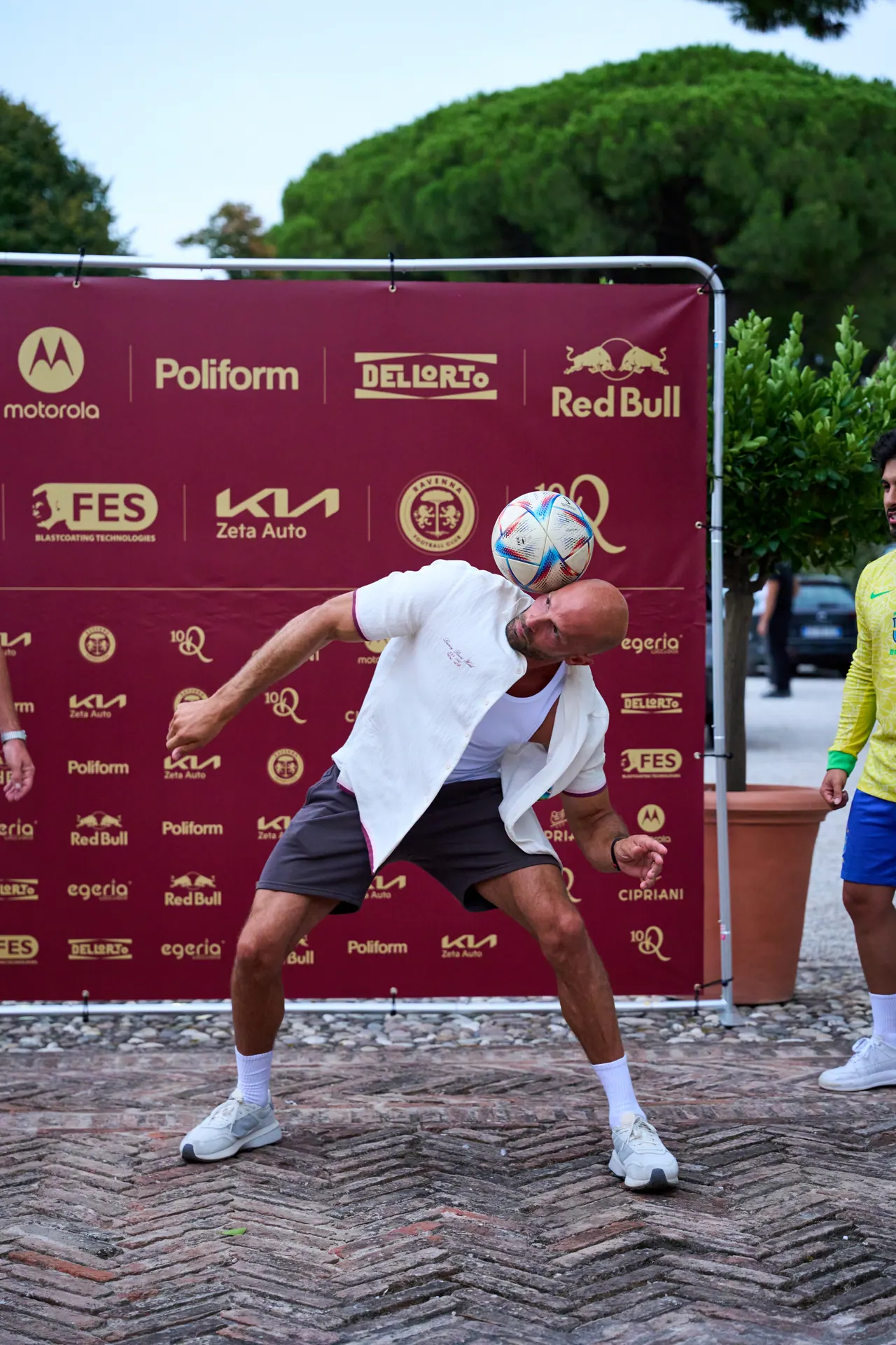 Daniel freestyling in front of a sponsor wall